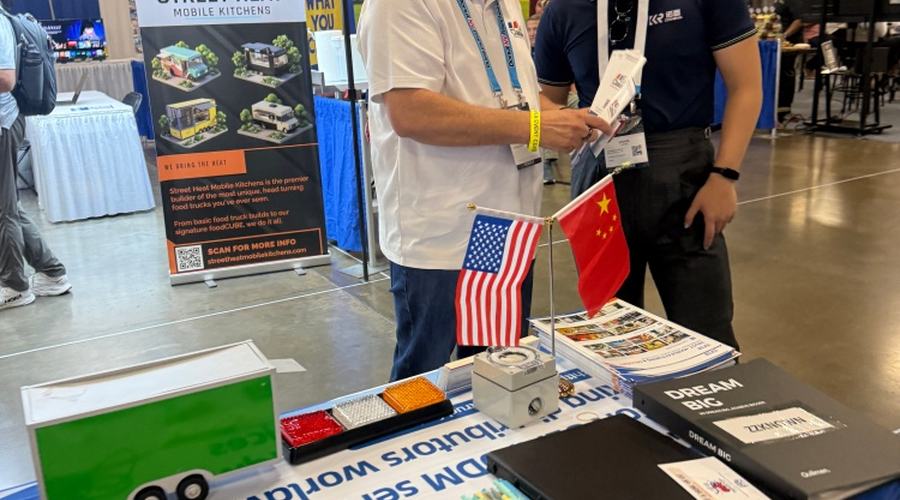 Detailed food trailer project review between an expo visitor and an international manufacturer representative